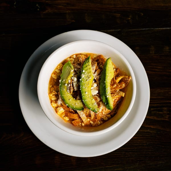 El Tarasco Restaurant Mooney's Mexican soup with avocado slices, cheese, and tortilla strips.